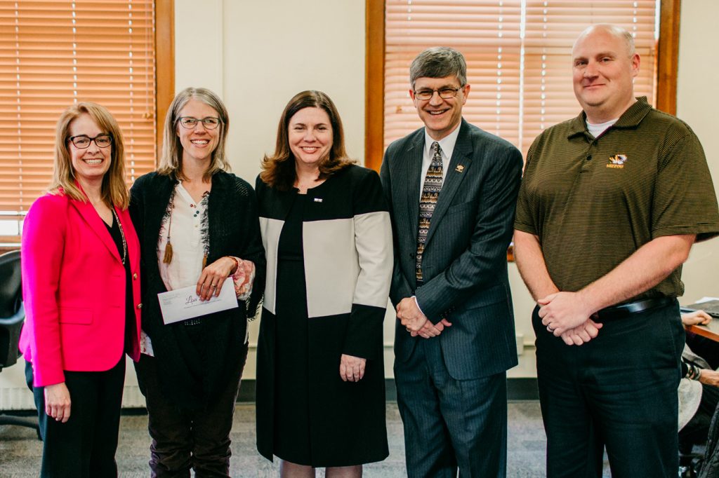 UM System Chief Human Resources Officer Marsha Fischer, Lisa Dorner, Dean Kathryn Chval, Provost Jim Spain, and Brad Curs, ELPA Department Chair, were on hand to present the award.