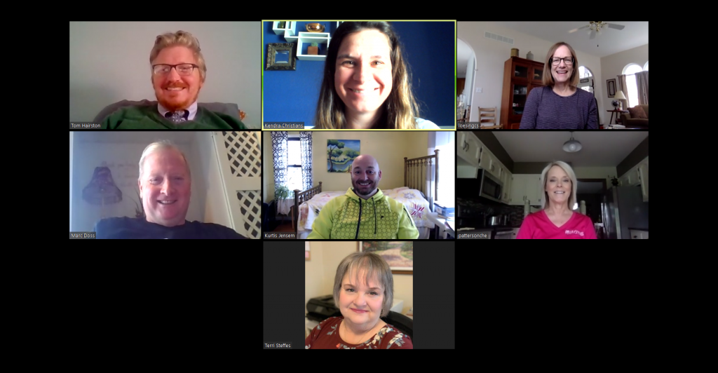 A photo of seven people on a zoom call.