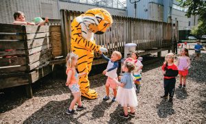 Truman the Tiger interacting with kids