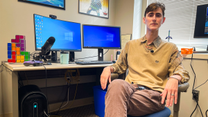 Noah Glaser at a desk