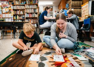 a teacher and student playing a game