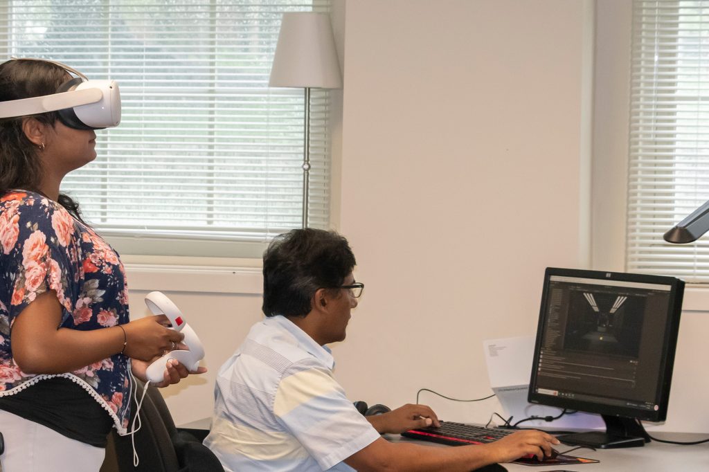 Sai Shreya Nuguri, a doctoral student, and Professor Prasad Calyam demonstrate the USucceed platform in Professor Noah Glaser's Information Experience Laboratory.