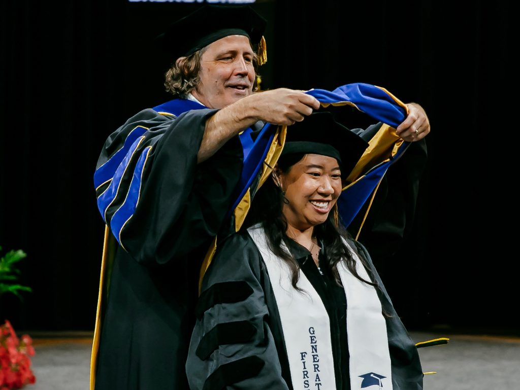 ESCP faculty member hooding a doctoral candidate