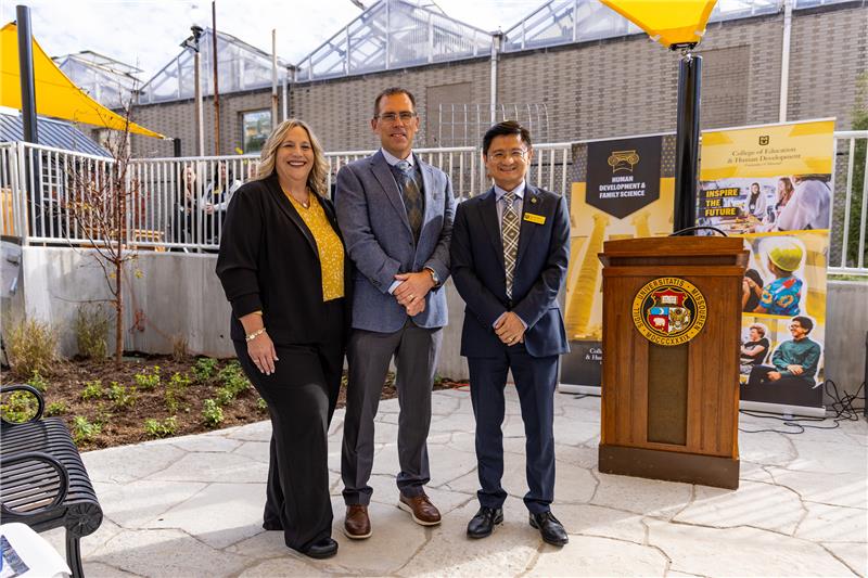 Three people posing for a photo