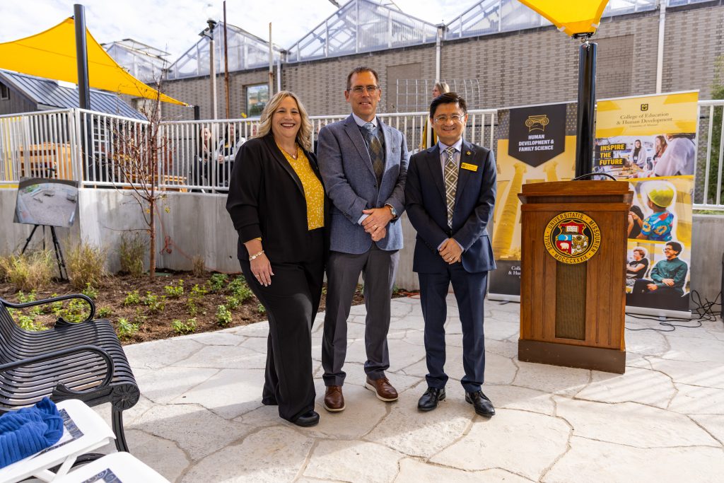Three people posing for a photo