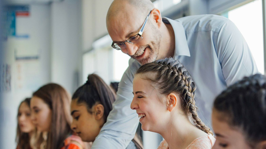 man helping female student