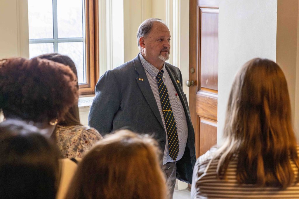 a man talking to a group of people