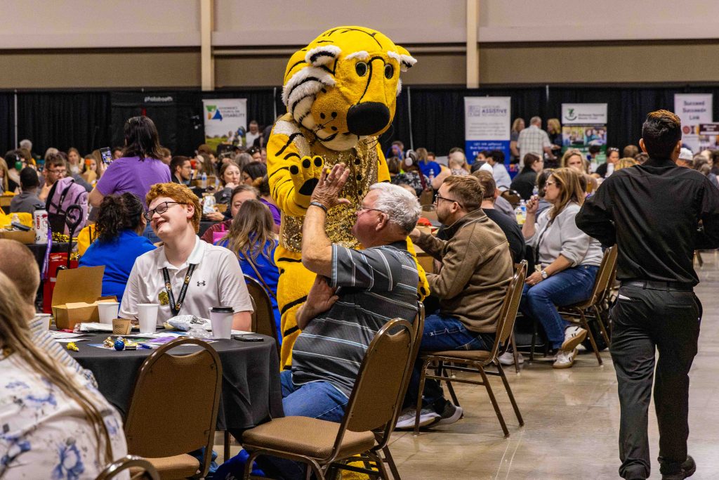 Truman interacts with families at the Missouri Job Olympics