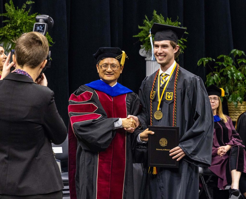 Undergraduate Commencement, Dean Kui Xie with student