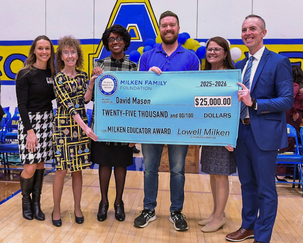 David Milken is awarded a check from the Milken Family Foundation