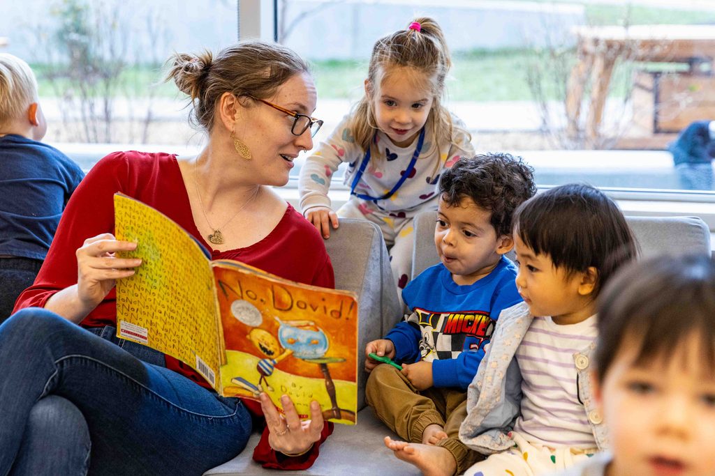 Miranda Clines reading with students at the Child Development Lab