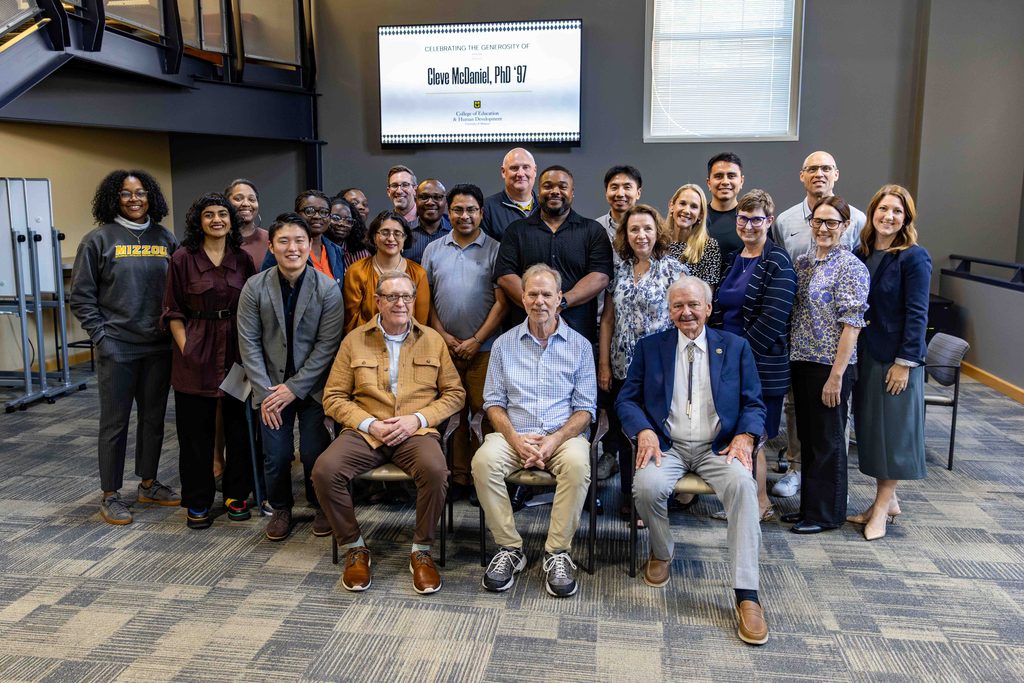the ELPA department poses with friends and family members of Cleve McDaniel