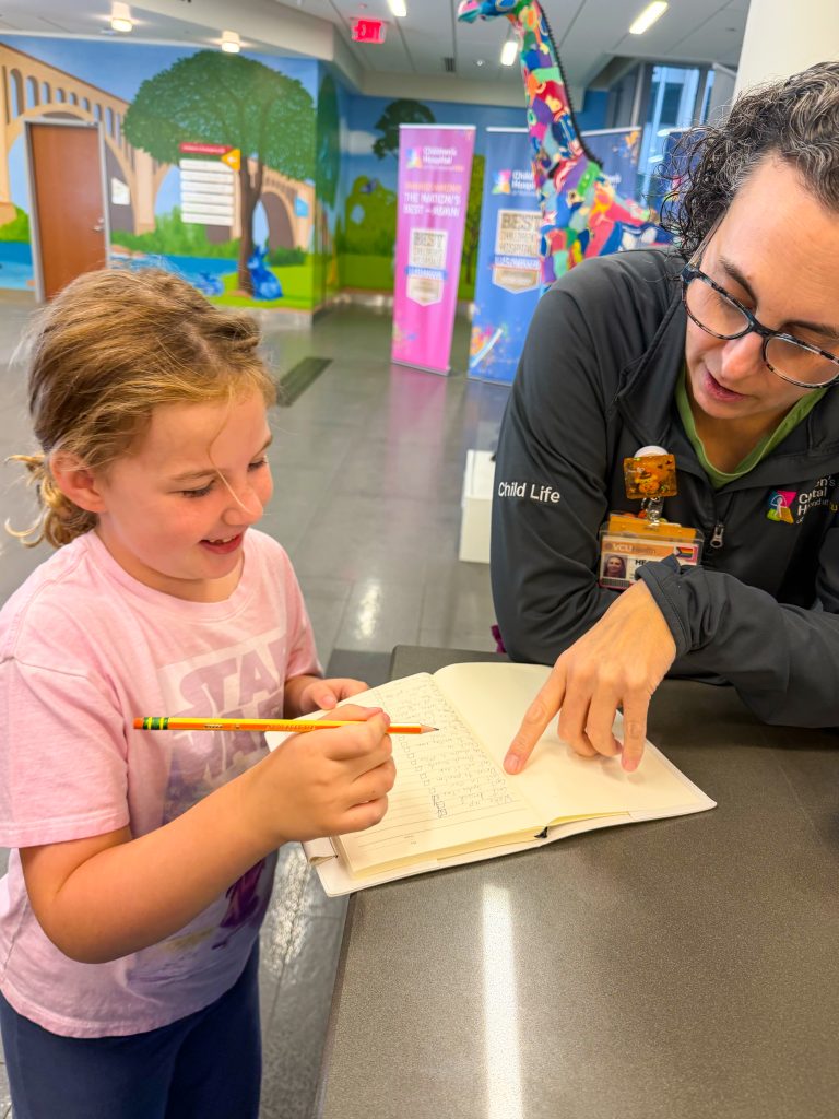child life personnel working with a patient