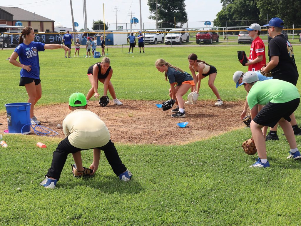 Kids learning how to play baseball