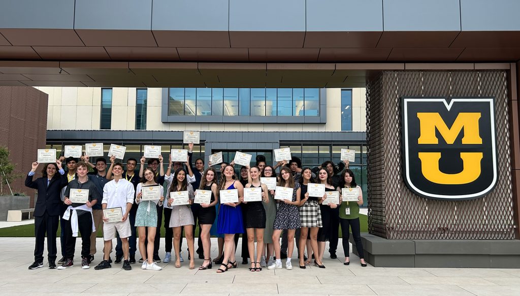 The MIE Class of 2023 Proudly Displays their Program Certificates 