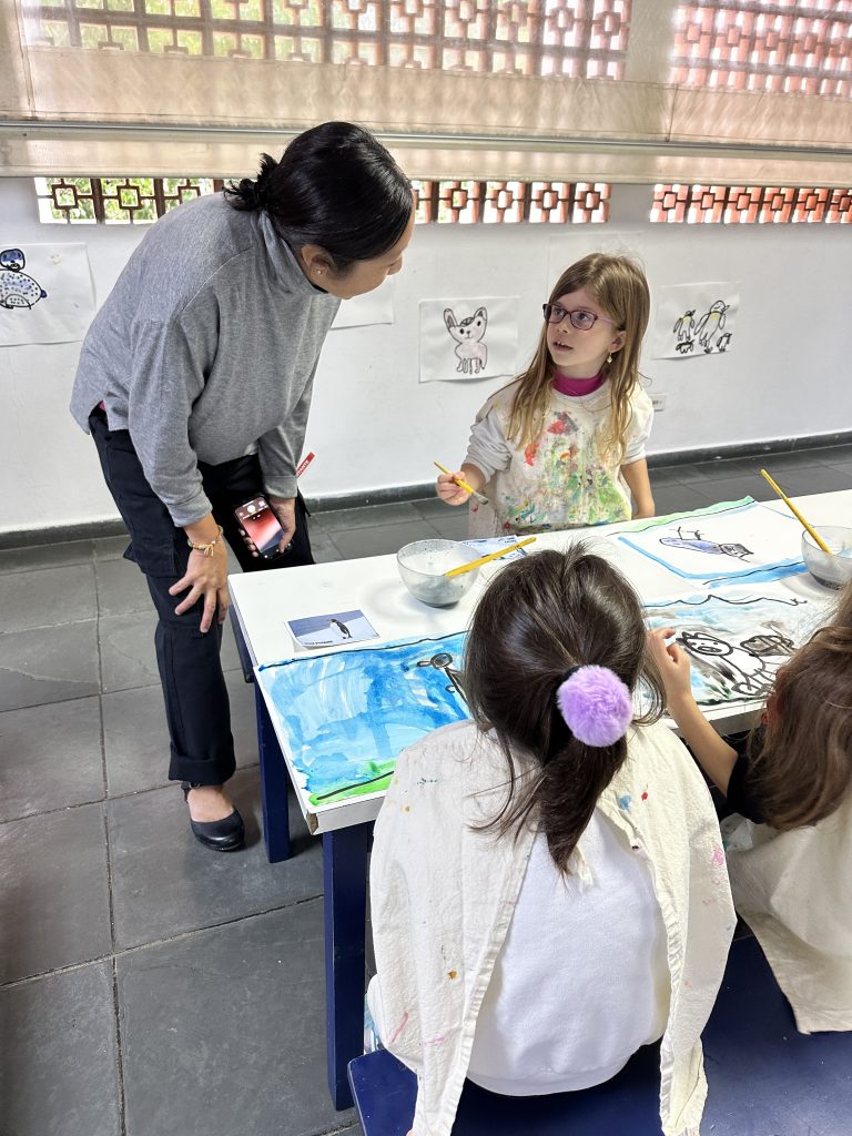 A teacher working with young children.